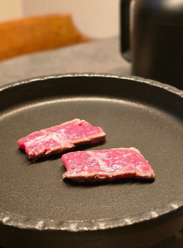 GOWOOGA Yeouido · premium marbled Hanwoo beef presented before grilling