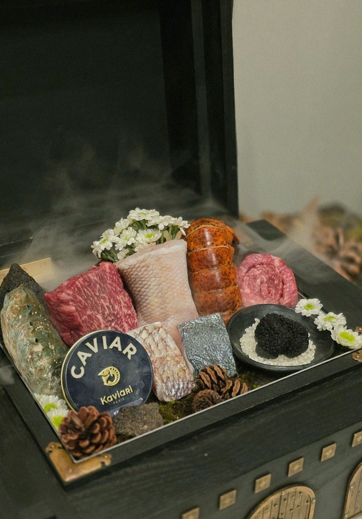 GOWOOGA Gwanghwamun · the signature Hanwoo showing — marbled beef cuts and caviar presented in a display chest