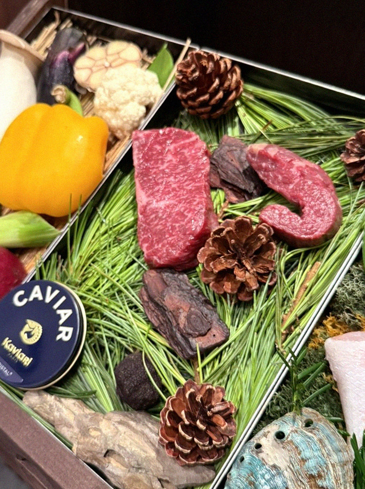 WOOHANA Yeouido · the signature Hanwoo showing — marbled beef cuts and caviar presented in a display chest