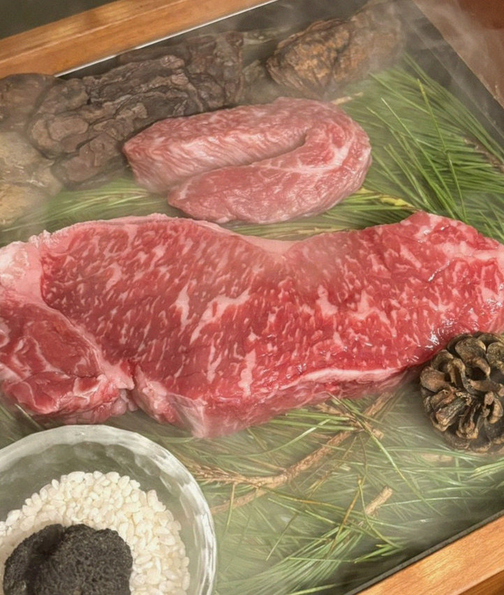 WOOARA Gwanghwamun · the signature Hanwoo showing — marbled beef cuts and caviar presented in a display chest