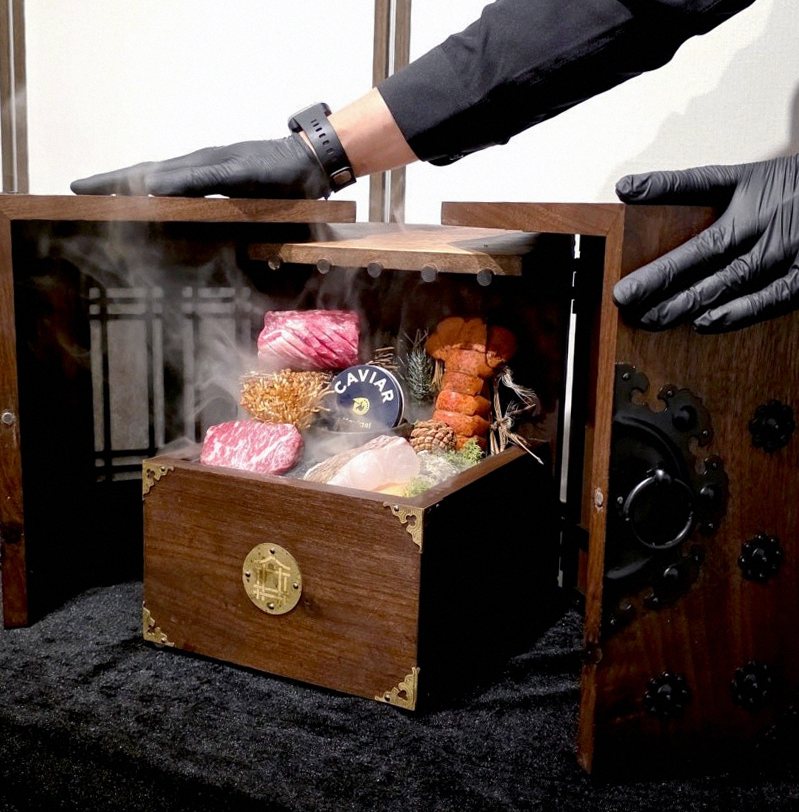DAEBOJUNG City Hall · the signature Hanwoo showing — marbled beef cuts and caviar presented in a display chest