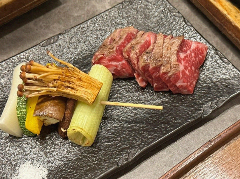 GOWOOGA Gwanghwamun · the signature Hanwoo showing — marbled beef cuts and caviar presented in a display chest
