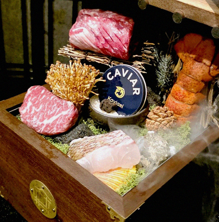 DAEBOJUNG Yeouido · the signature Hanwoo showing — marbled beef cuts and caviar presented in a display chest
