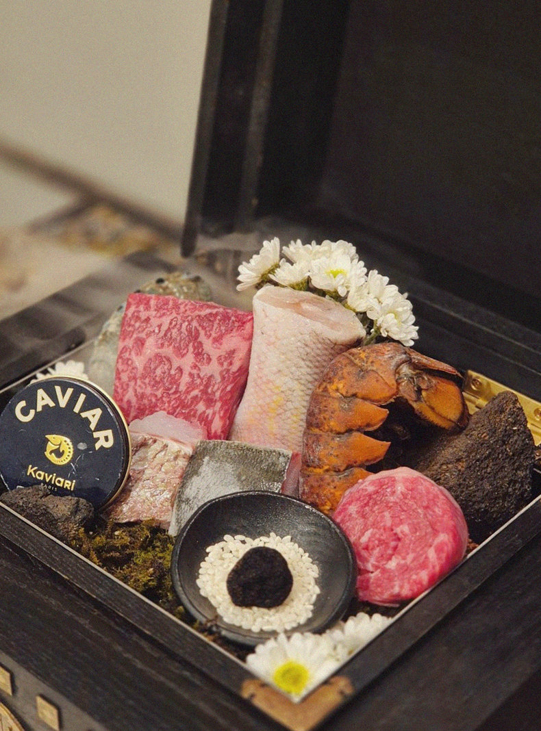 GOWOOGA Gwanghwamun · the signature Hanwoo showing — marbled beef cuts and caviar presented in a display chest