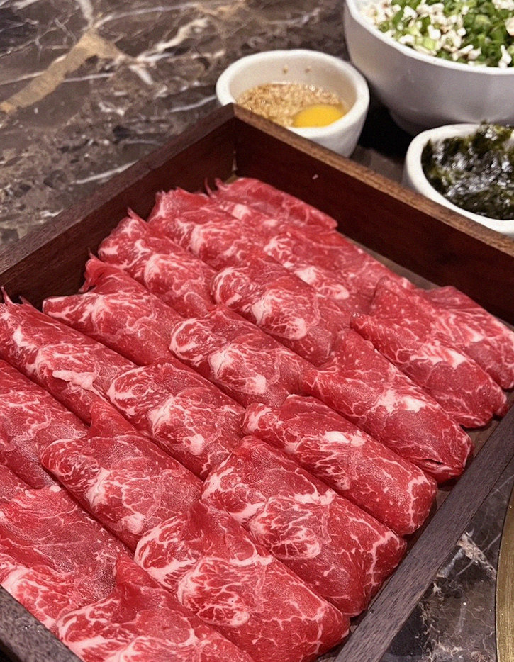 DAEBOJUNG City Hall · premium marbled Hanwoo beef presented before grilling