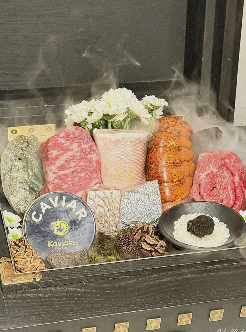 GOWOOGA Gwanghwamun · the signature Hanwoo showing — marbled beef cuts and caviar presented in a display chest