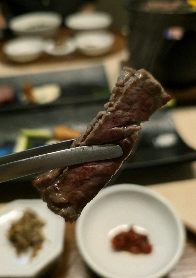 WOOARA Yeouido · premium marbled Hanwoo beef presented before grilling