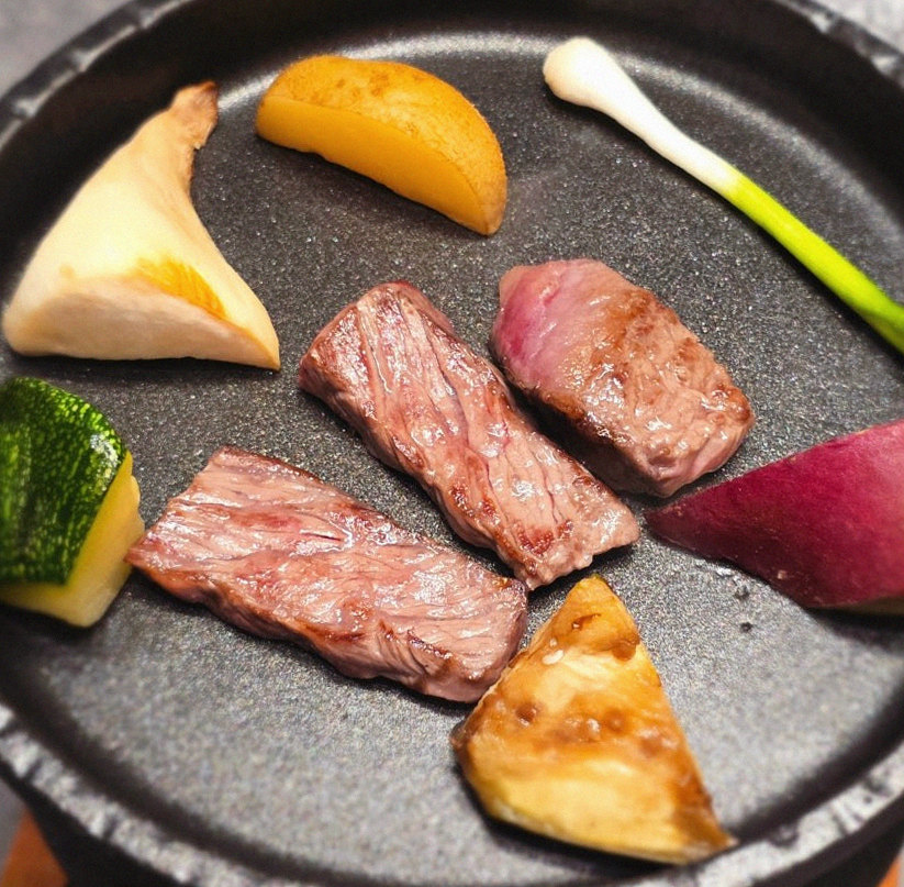 WOOHANA Jonggak · the signature Hanwoo showing — marbled beef cuts and caviar presented in a display chest