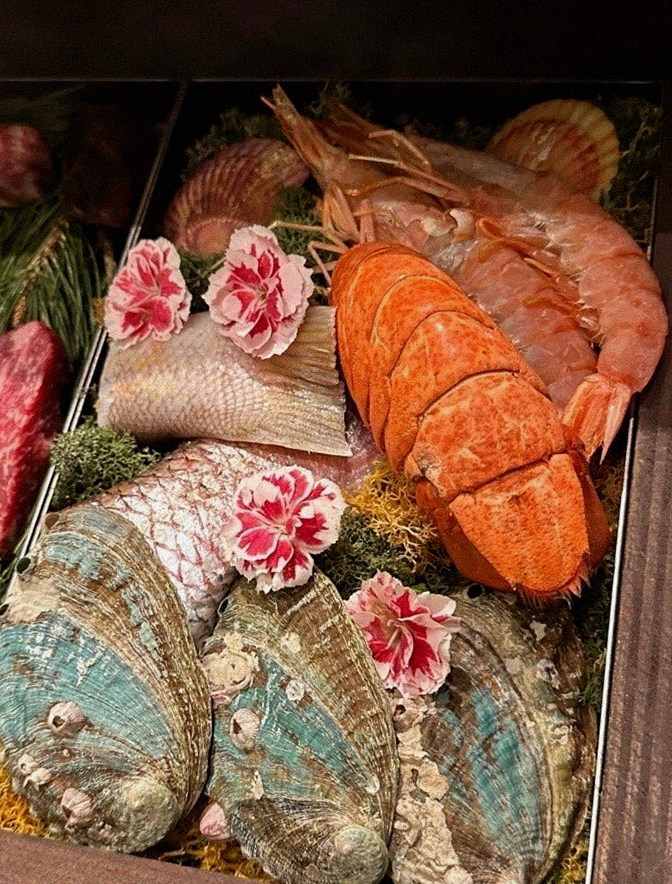WOOHANA Jonggak · seafood course served alongside the beef
