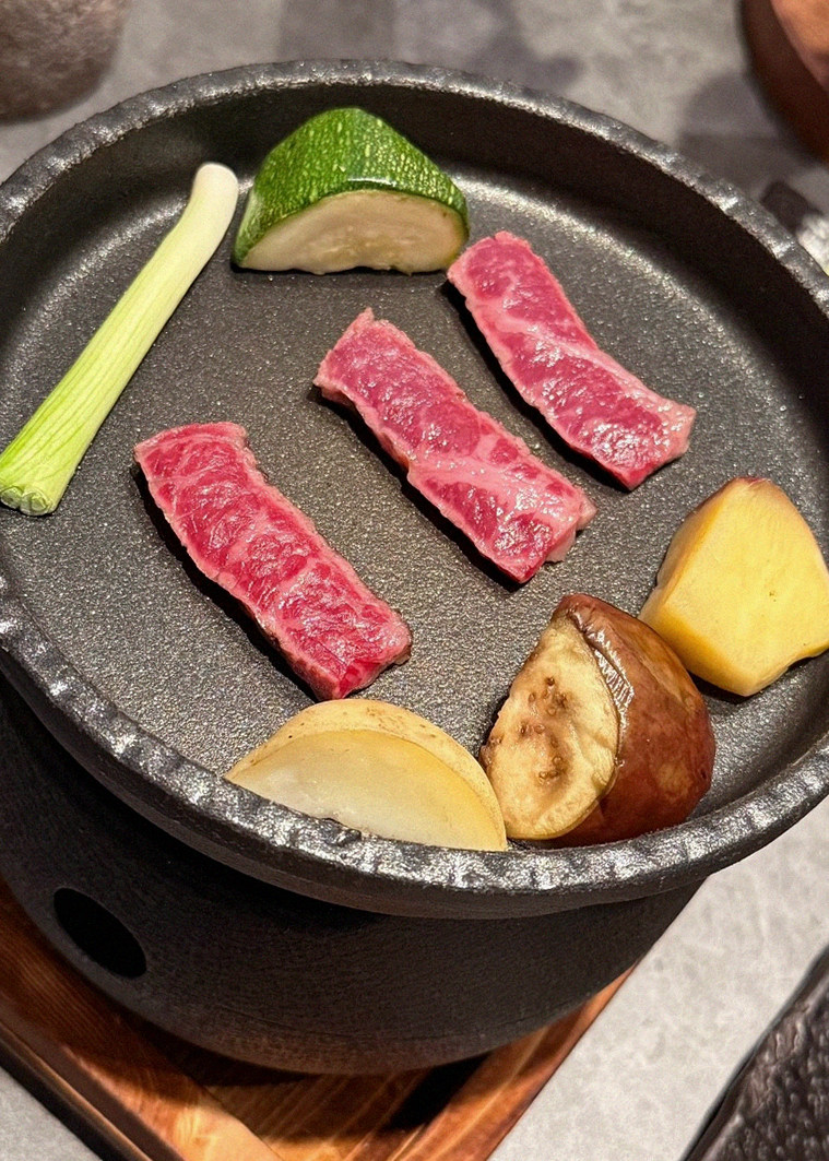 WOOHANA Jonggak · the signature Hanwoo showing — marbled beef cuts and caviar presented in a display chest