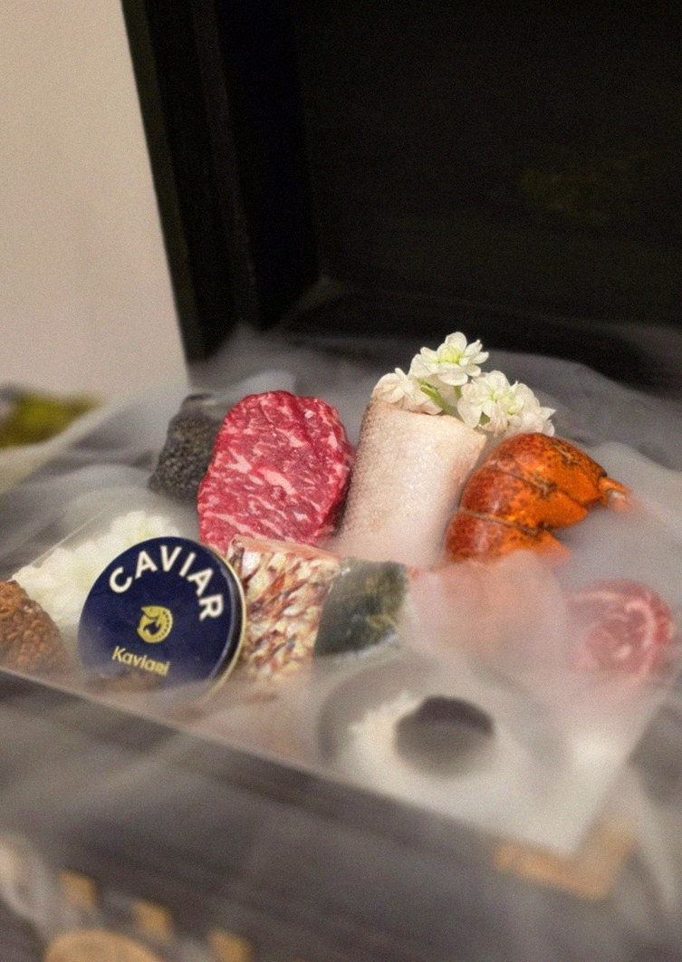 GOWOOGA Gwanghwamun · the signature Hanwoo showing — marbled beef cuts and caviar presented in a display chest