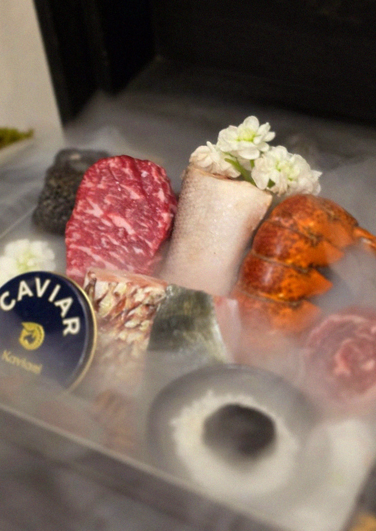GOWOOGA Gwanghwamun · the signature Hanwoo showing — marbled beef cuts and caviar presented in a display chest
