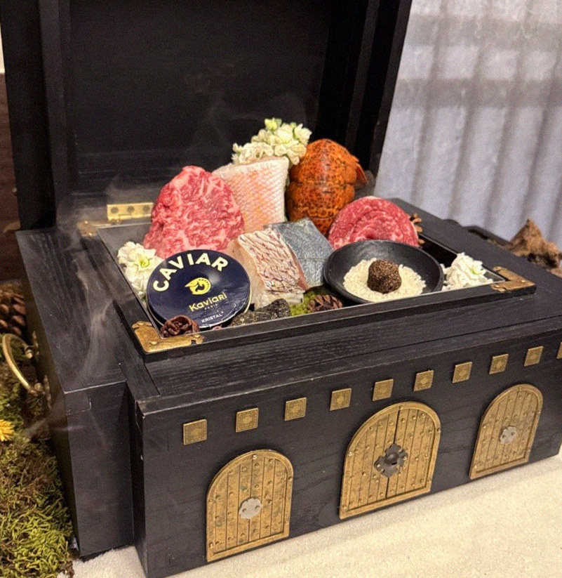 GOWOOGA Gwanghwamun · the signature Hanwoo showing — marbled beef cuts and caviar presented in a display chest