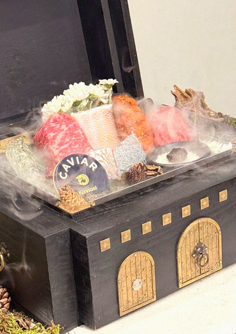 GOWOOGA Gwanghwamun · the signature Hanwoo showing — marbled beef cuts and caviar presented in a display chest