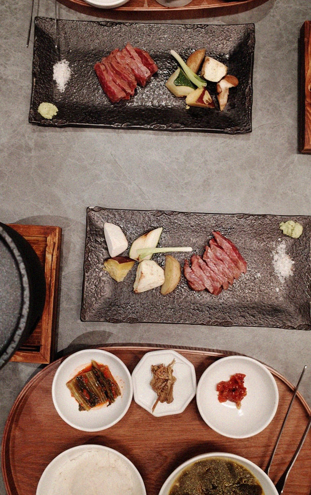 WOOHANA Jonggak · the signature Hanwoo showing — marbled beef cuts and caviar presented in a display chest