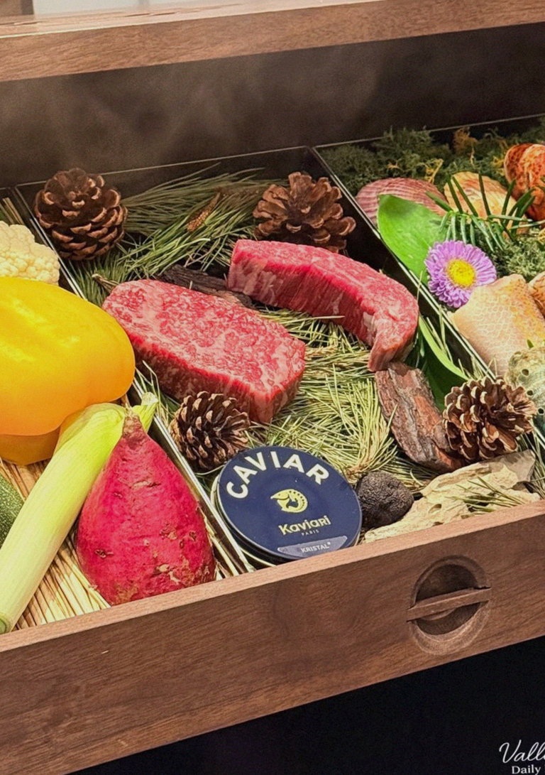 WOOHANA Yeouido · the signature Hanwoo showing — marbled beef cuts and caviar presented in a display chest