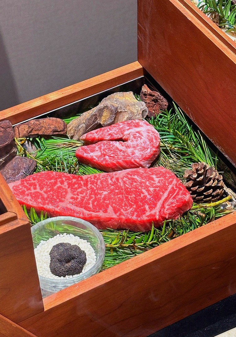 WOOARA Gwanghwamun · the signature Hanwoo showing — marbled beef cuts and caviar presented in a display chest