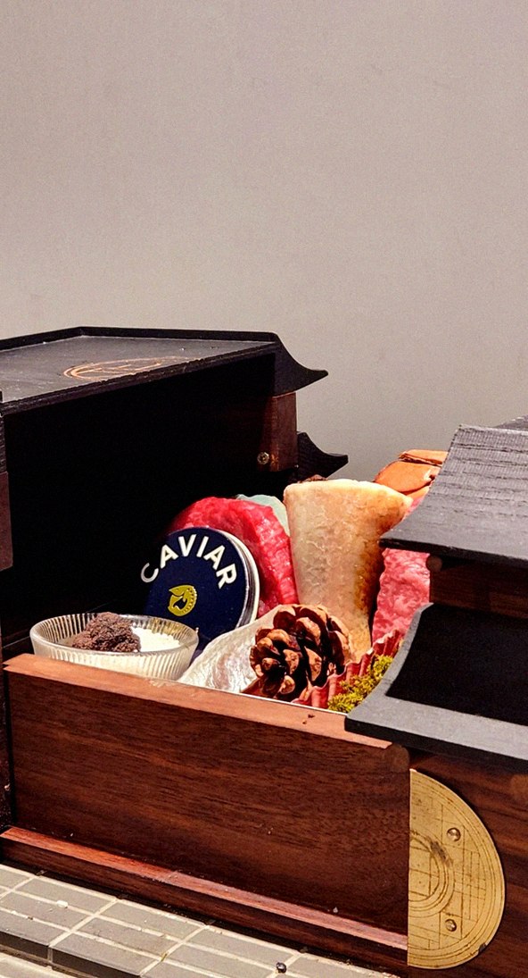 GOWOOGA Gangnam·Yeoksam · the signature Hanwoo showing — marbled beef cuts and caviar presented in a display chest