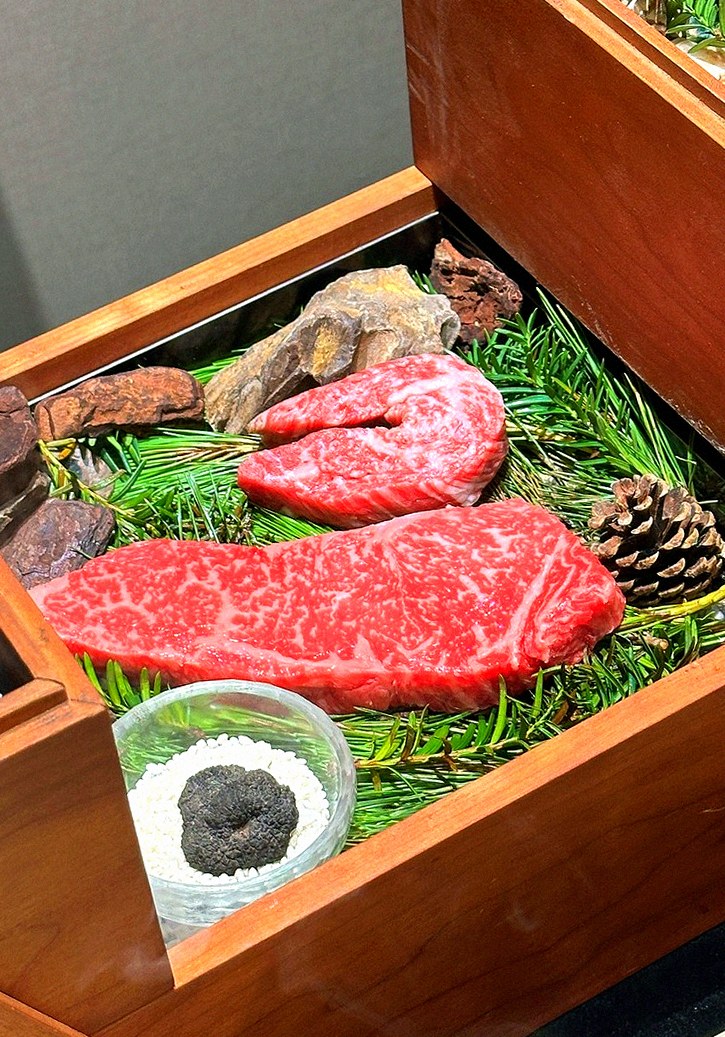 WOOARA Gwanghwamun · the signature Hanwoo showing — marbled beef cuts and caviar presented in a display chest