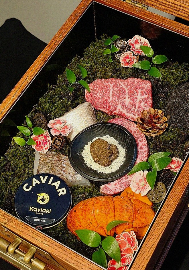 GOWOOGA Yeouido · the signature Hanwoo showing — marbled beef cuts and caviar presented in a display chest