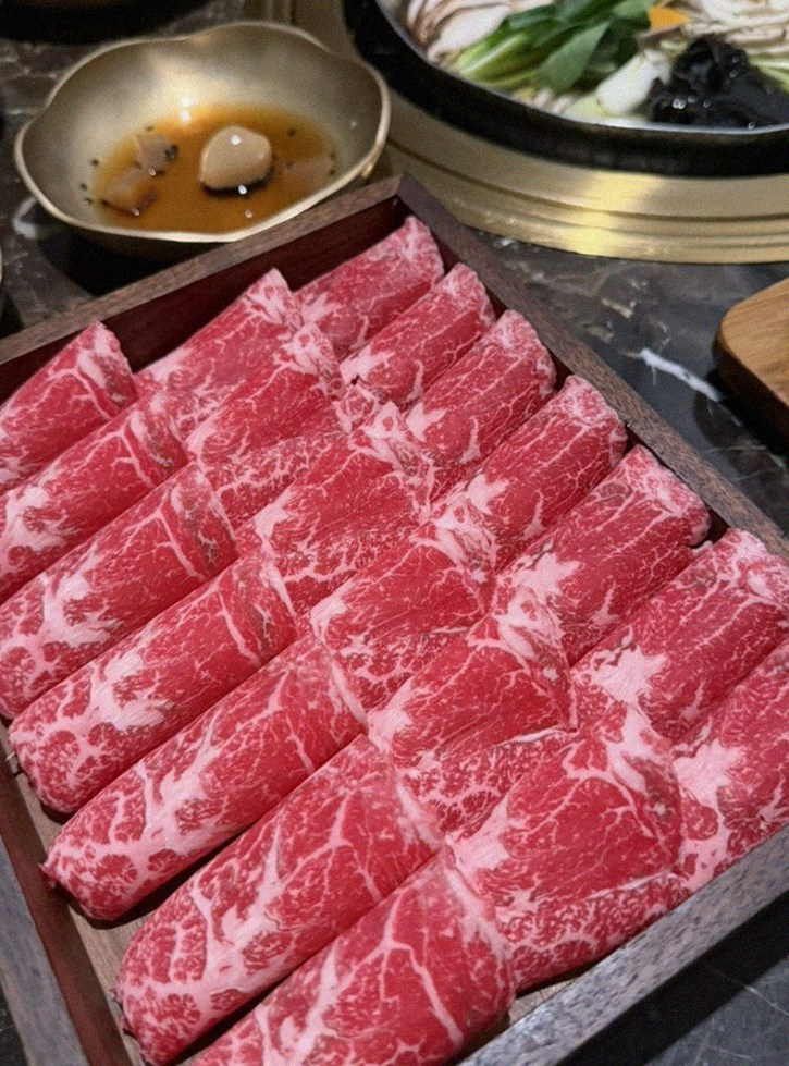 DAEBOJUNG City Hall · premium marbled Hanwoo beef presented before grilling