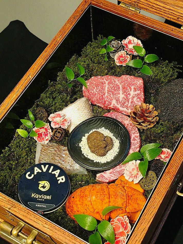 GOWOOGA Yeouido · the signature Hanwoo showing — marbled beef cuts and caviar presented in a display chest