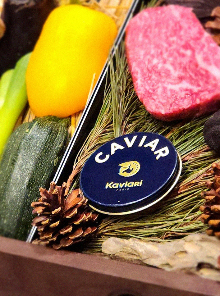WOOHANA Jonggak · the signature Hanwoo showing — marbled beef cuts and caviar presented in a display chest