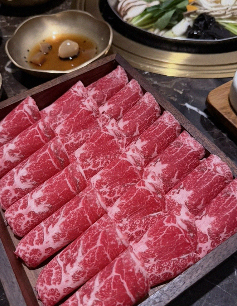DAEBOJUNG City Hall · premium marbled Hanwoo beef presented before grilling