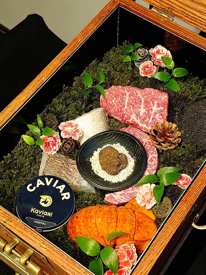 GOWOOGA Yeouido · the signature Hanwoo showing — marbled beef cuts and caviar presented in a display chest