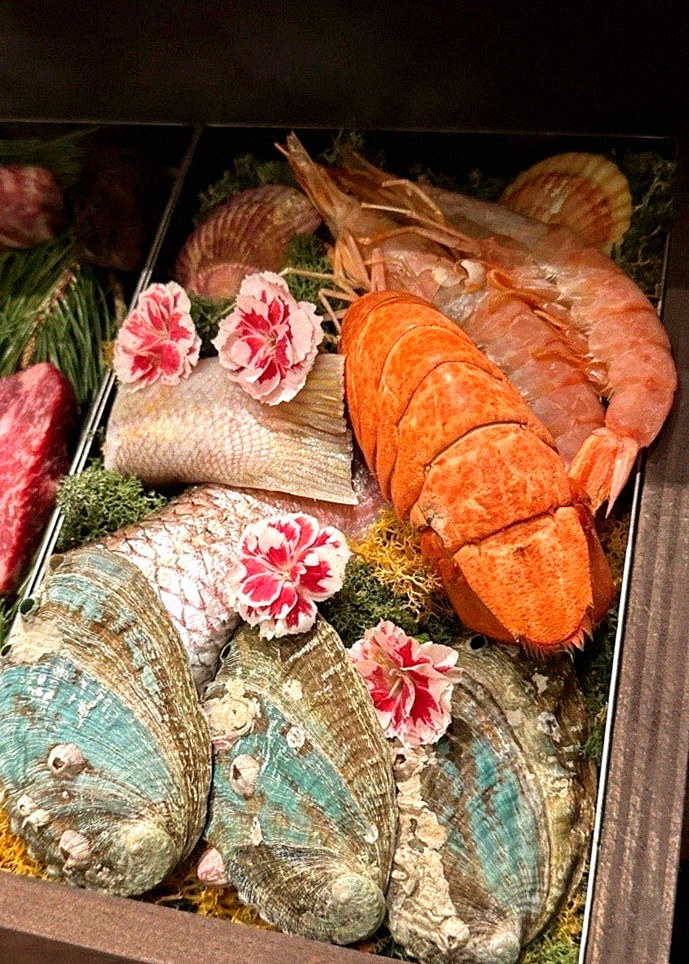 WOOHANA Jonggak · seafood course served alongside the beef