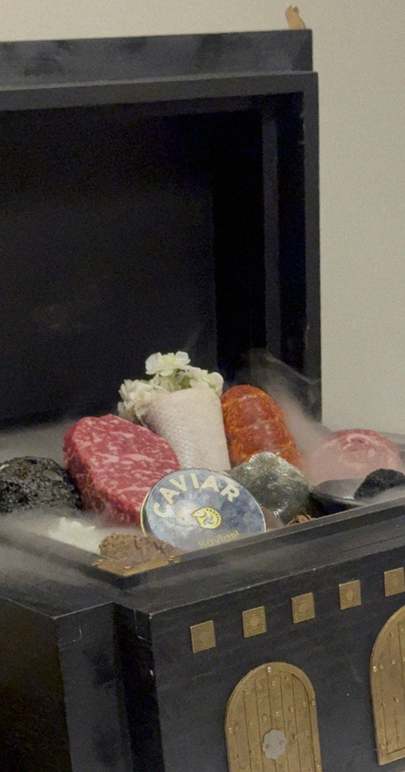 GOWOOGA Gwanghwamun · the signature Hanwoo showing — marbled beef cuts and caviar presented in a display chest
