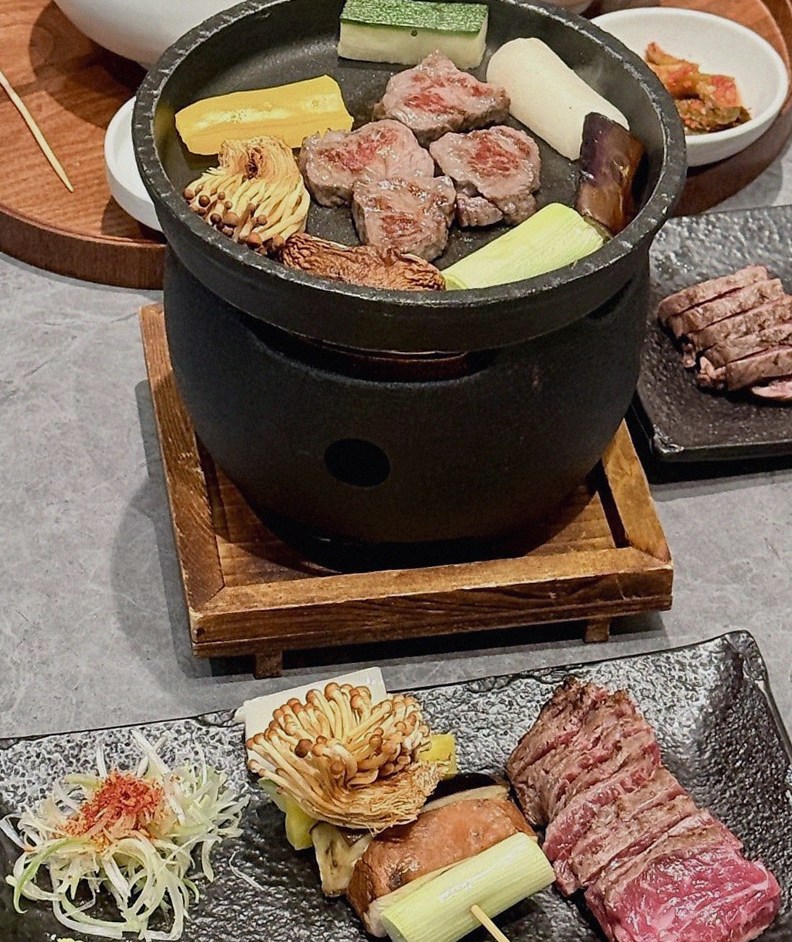 GOWOOGA Gangnam·Yeoksam · the signature Hanwoo showing — marbled beef cuts and caviar presented in a display chest