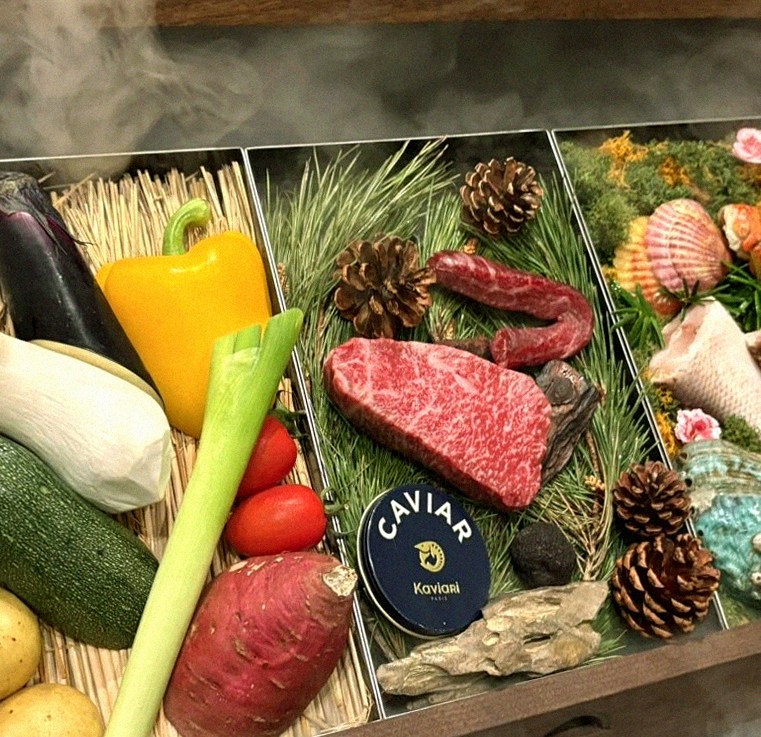 WOOHANA Jonggak · the signature Hanwoo showing — marbled beef cuts and caviar presented in a display chest