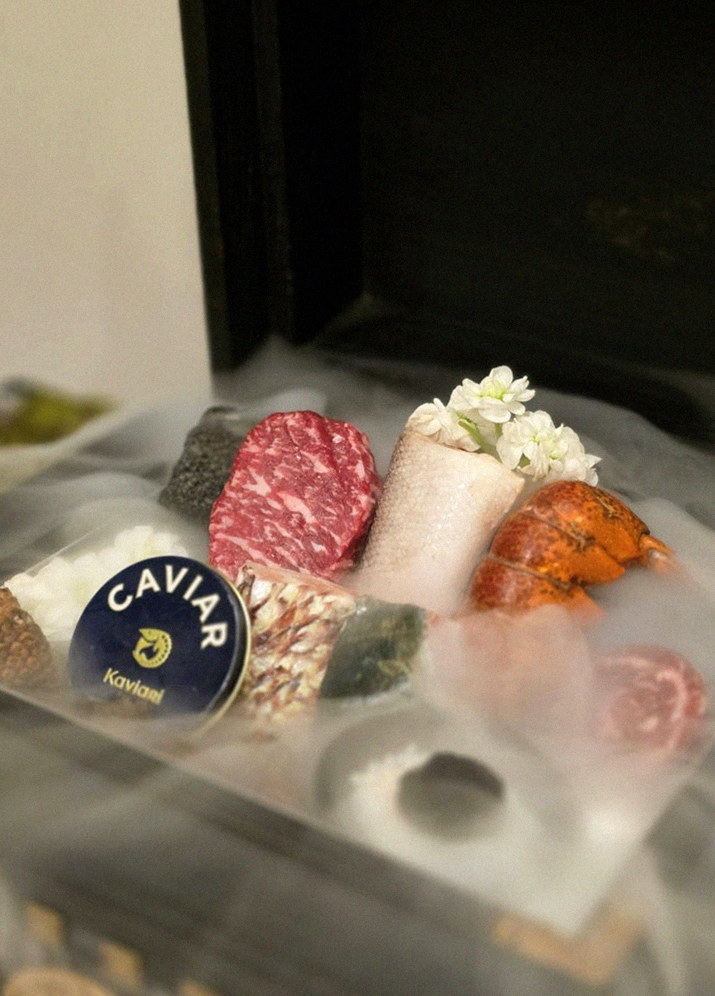 GOWOOGA Gwanghwamun · the signature Hanwoo showing — marbled beef cuts and caviar presented in a display chest