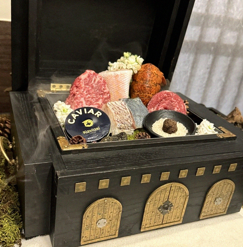 GOWOOGA Gwanghwamun · the signature Hanwoo showing — marbled beef cuts and caviar presented in a display chest