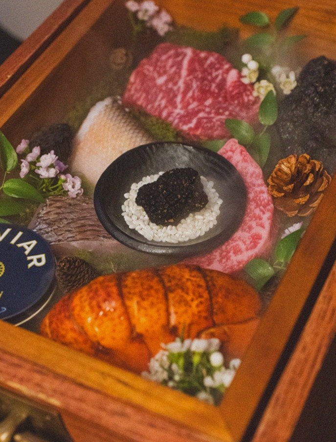 GOWOOGA Yeouido · the signature Hanwoo showing — marbled beef cuts and caviar presented in a display chest
