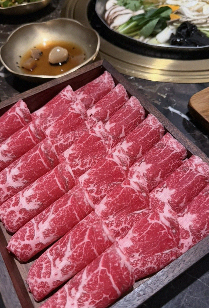 DAEBOJUNG City Hall · premium marbled Hanwoo beef presented before grilling