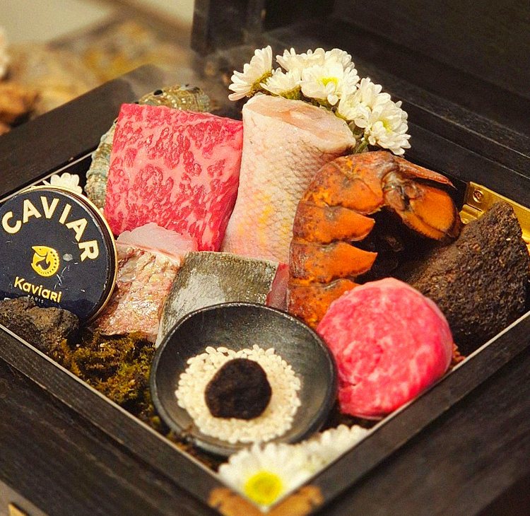 GOWOOGA Gwanghwamun · the signature Hanwoo showing — marbled beef cuts and caviar presented in a display chest