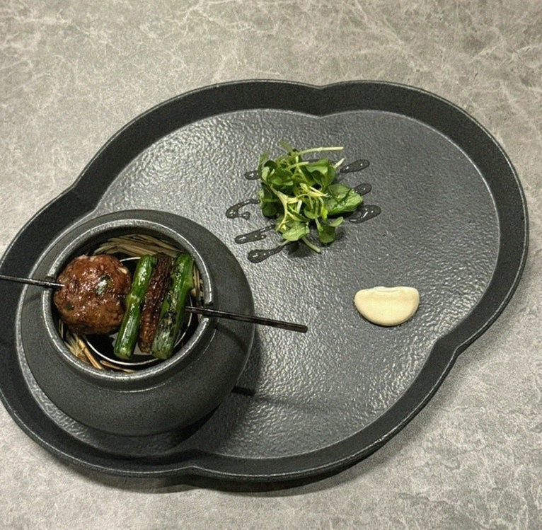 GOWOOGA Gwanghwamun · the signature Hanwoo showing — marbled beef cuts and caviar presented in a display chest