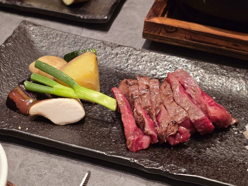 WOOHANA Yeouido · the signature Hanwoo showing — marbled beef cuts and caviar presented in a display chest