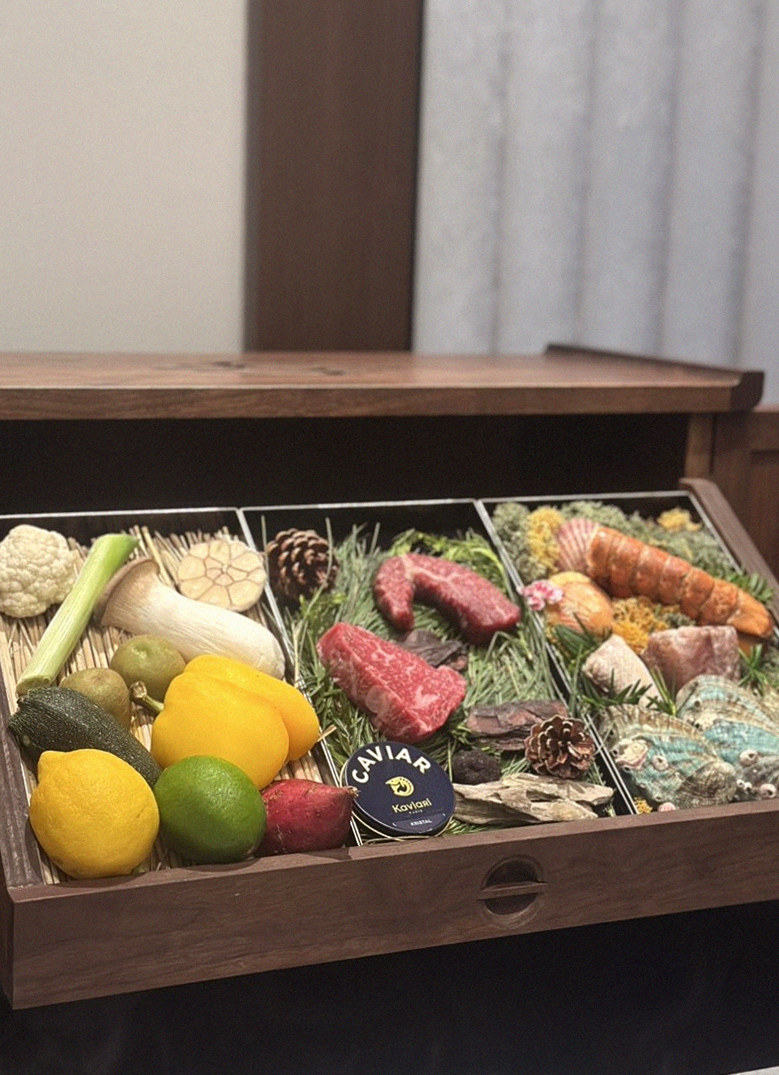 WOOHANA Yeouido · the signature Hanwoo showing — marbled beef cuts and caviar presented in a display chest