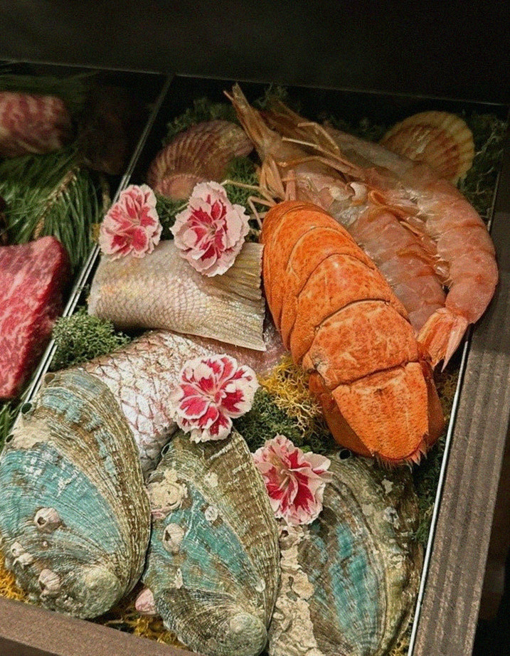 WOOHANA Jonggak · seafood course served alongside the beef