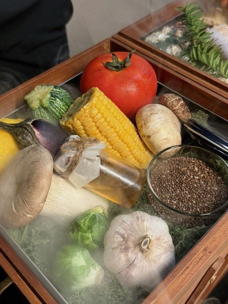 WOOARA Yeouido · the signature Hanwoo showing — marbled beef cuts and caviar presented in a display chest