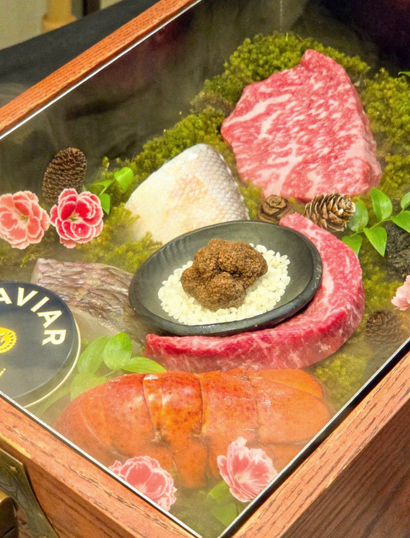GOWOOGA Yeouido · the signature Hanwoo showing — marbled beef cuts and caviar presented in a display chest