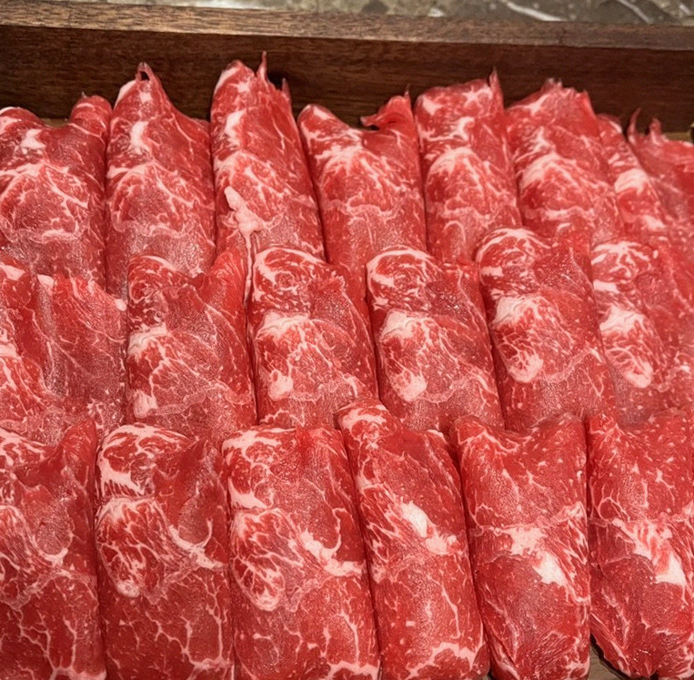 DAEBOJUNG Yeouido · premium marbled Hanwoo beef presented before grilling
