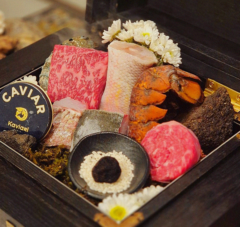 GOWOOGA Gwanghwamun · the signature Hanwoo showing — marbled beef cuts and caviar presented in a display chest