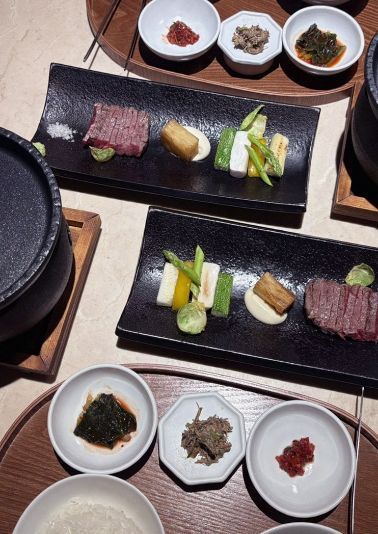 WOOARA Gwanghwamun · the signature Hanwoo showing — marbled beef cuts and caviar presented in a display chest
