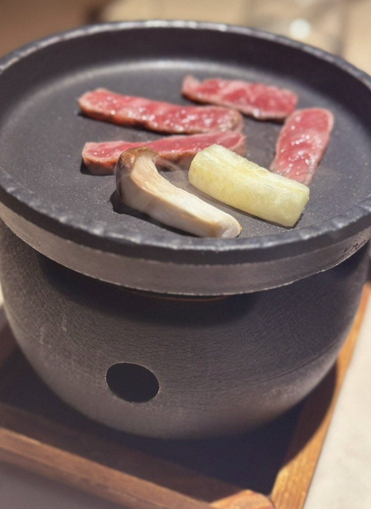 WOOARA Gwanghwamun · the signature Hanwoo showing — marbled beef cuts and caviar presented in a display chest
