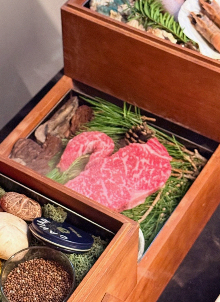 WOOARA Gwanghwamun · the signature Hanwoo showing — marbled beef cuts and caviar presented in a display chest