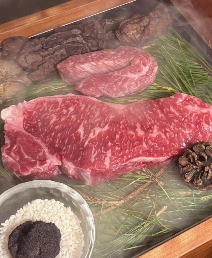 WOOARA Gwanghwamun · the signature Hanwoo showing — marbled beef cuts and caviar presented in a display chest